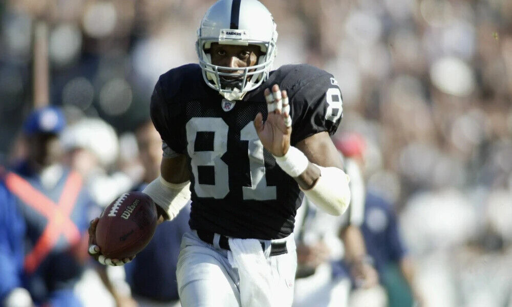 Tim Brown Signed Oakland Raiders Jersey (Beckett COA) 9xPro Bowl Wide Receiver