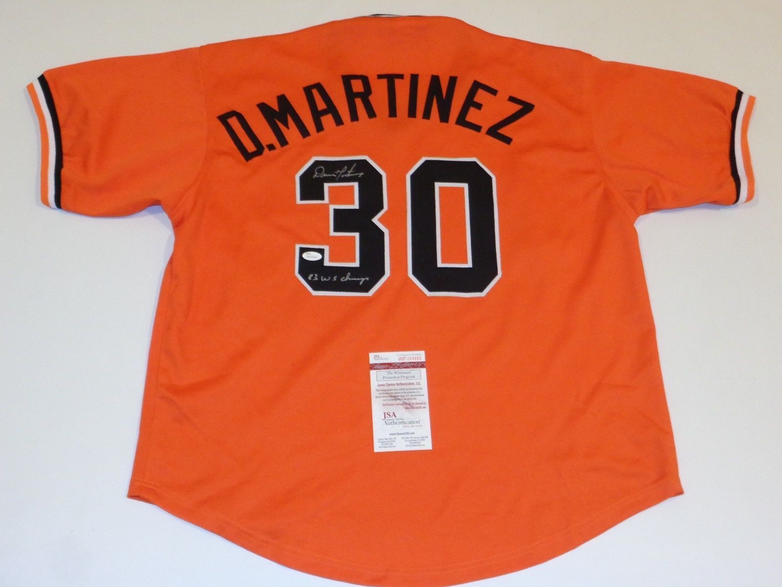 Dennis Martínez Signed Orioles Orange Throwback Jersey (JSA COA) 83 WS Champs