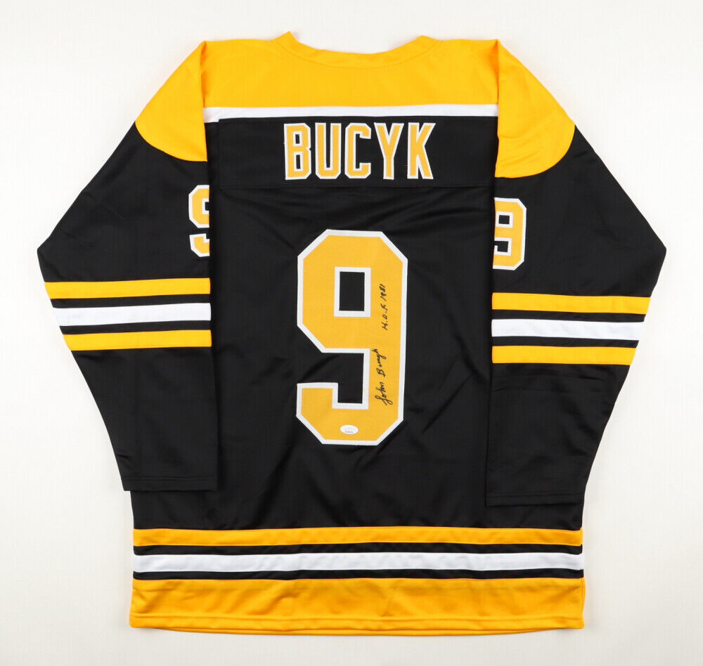 Johnny Bucyk Signed Bruins Captain Jersey Inscribed "H.O.F. 1981" (JSA COA)