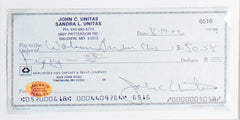 Johnny Unitas Signed Check In 14×18 Matted Display (SOP COA) Baltimore Colts Q.B