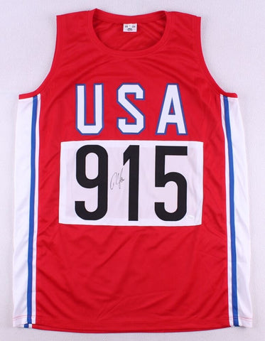 Carl Lewis Signed Team USA Olympic Jersey (JSA COA) 9xOlympic Gold Medalist